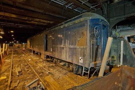 The entire secret train car has the word’s MNCX 002 on it