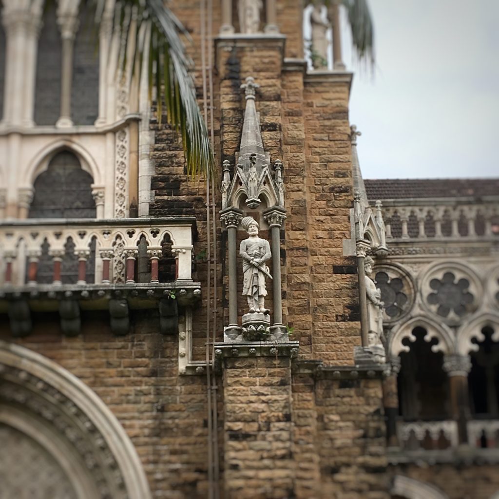 The statues on the Rajabai Tower representing the 24 'castes' of Western India