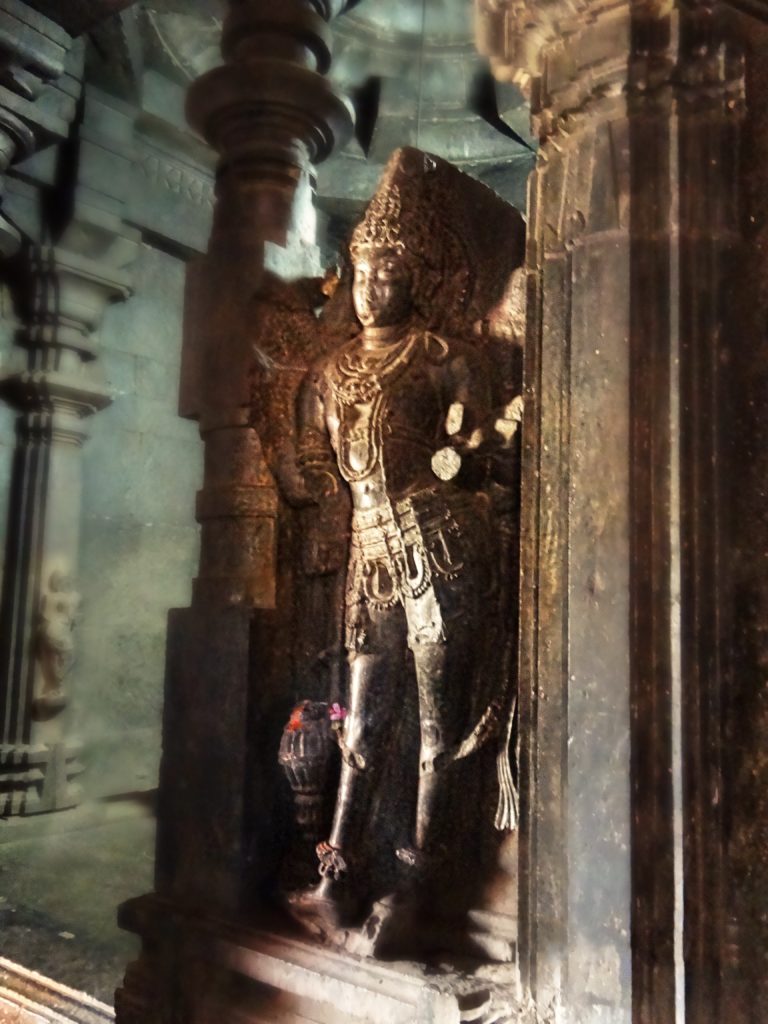 The statue of Jay flanking the Garbhagriha